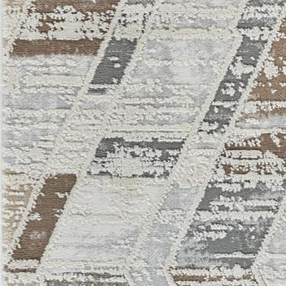 5' X 8' Beige and Brown Abstract Distressed Area Rug