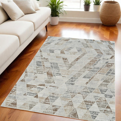 5' X 8' Beige and Brown Abstract Distressed Area Rug