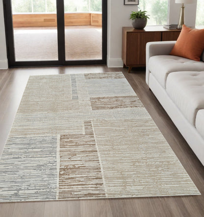 5' X 8' Beige and Brown Abstract Distressed Area Rug