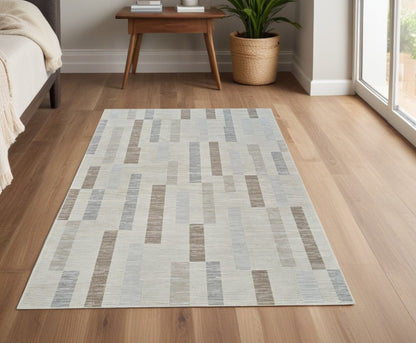 4' X 6' Beige and Brown Abstract Distressed Area Rug