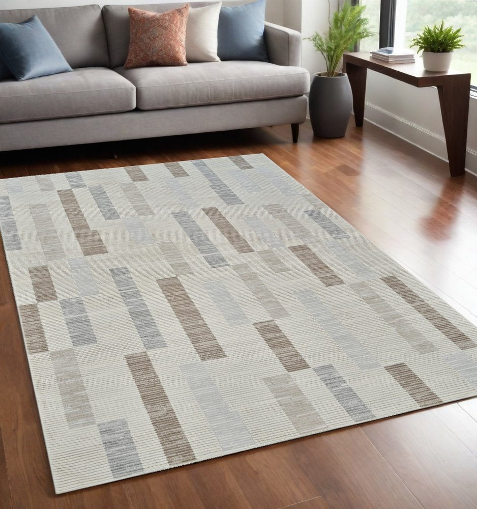 5' X 8' Beige and Brown Abstract Distressed Area Rug