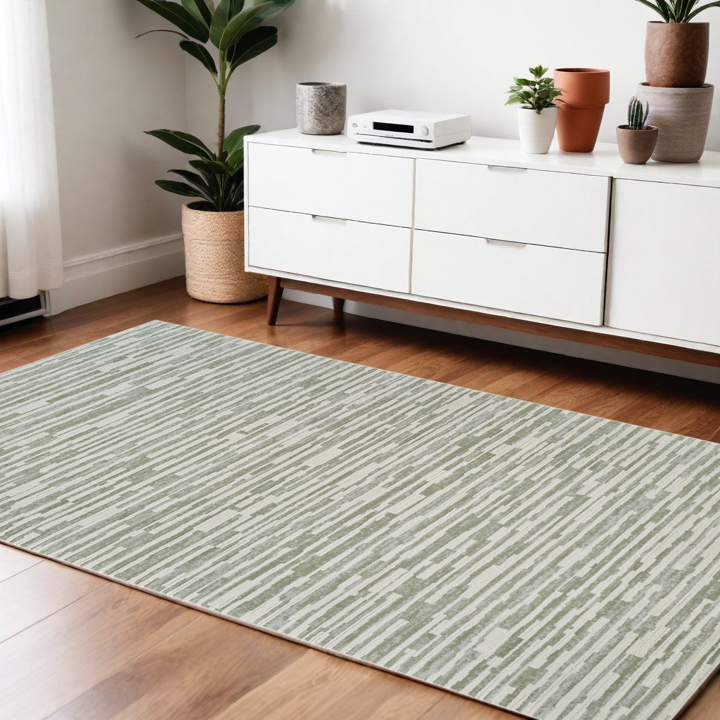 4' X 6' Beige and Green Abstract Distressed Area Rug