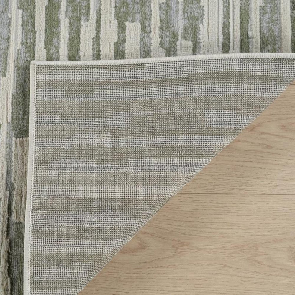 4' X 6' Beige and Green Abstract Distressed Area Rug