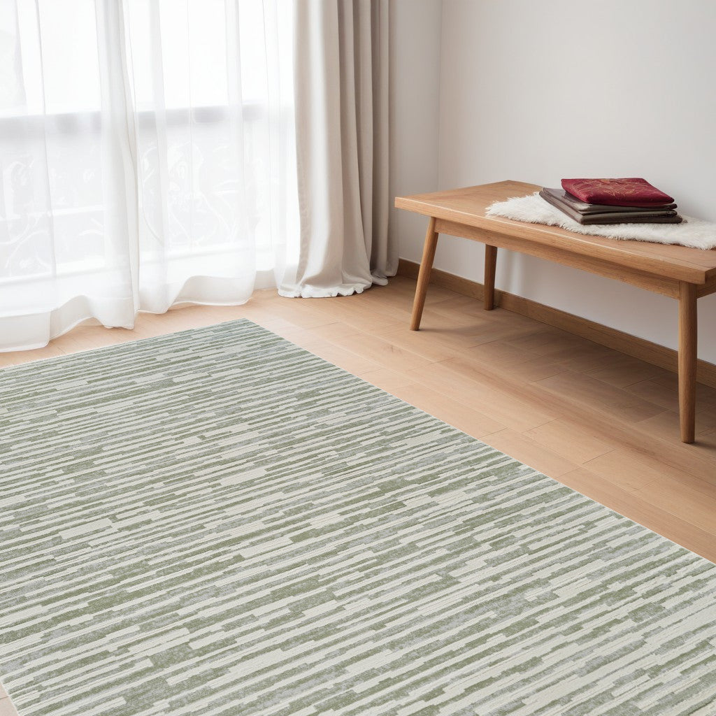 5' X 8' Beige and Green Abstract Distressed Area Rug