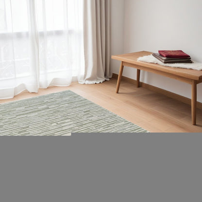 5' X 8' Beige and Green Abstract Distressed Area Rug