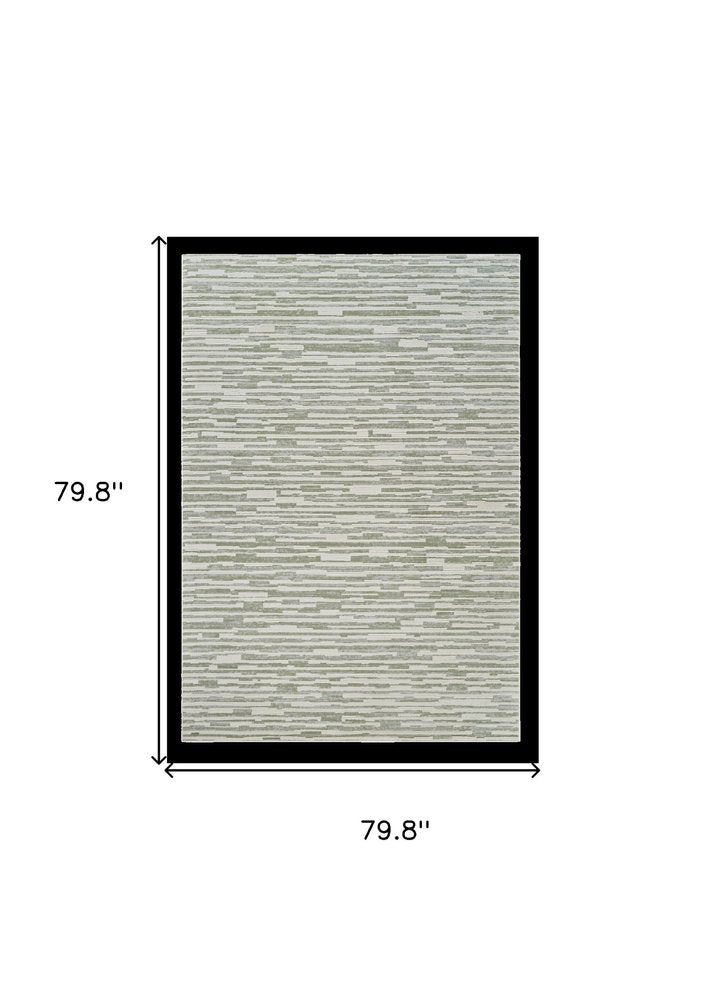 7' X 10' Beige and Green Abstract Distressed Area Rug