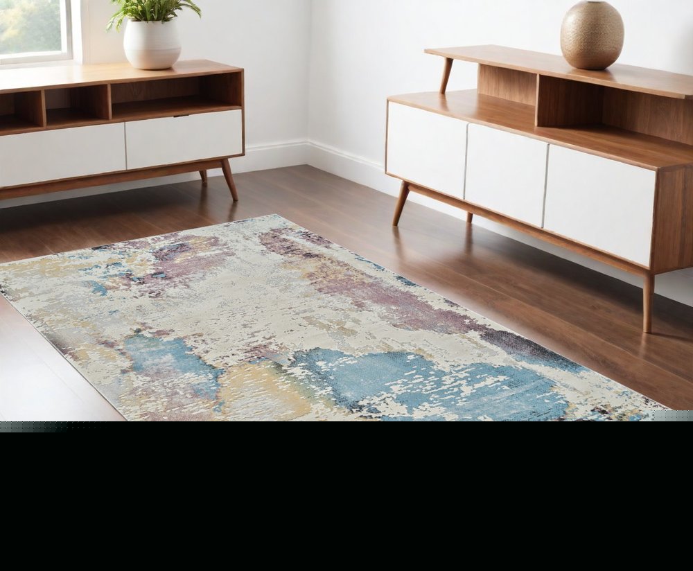 4' X 6' Beige and Blue Abstract Distressed Area Rug