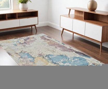 4' X 6' Beige and Blue Abstract Distressed Area Rug