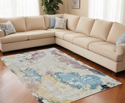5' X 8' Beige and Blue Abstract Distressed Area Rug