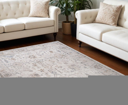 7' X 10' Beige and Ivory Abstract Distressed Area Rug