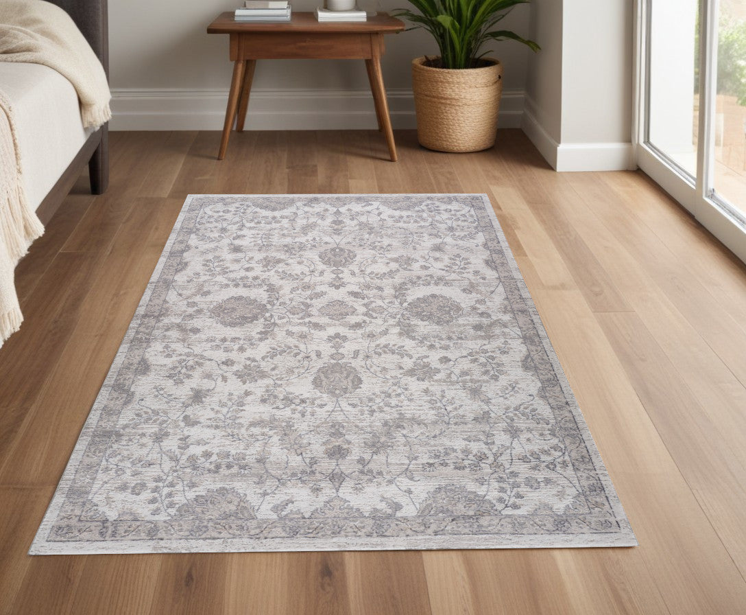 4' X 6' Beige and Gray Floral Distressed Area Rug