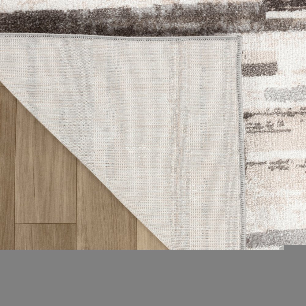 5' X 8' Beige and Brown Abstract Distressed Area Rug