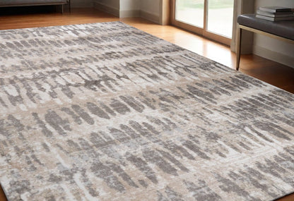 5' X 8' Beige and Brown Abstract Distressed Area Rug