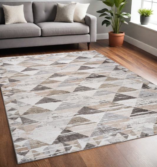 5' X 8' Beige and Brown Abstract Distressed Area Rug