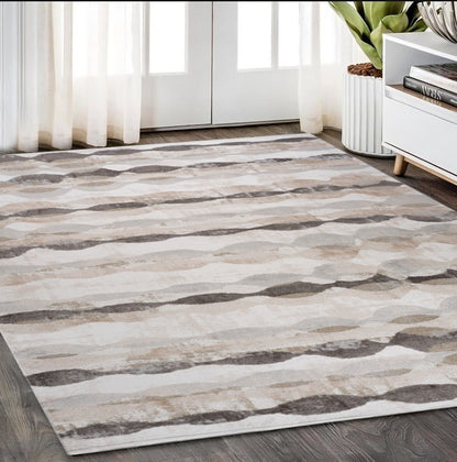 5' X 8' Beige and Brown Abstract Distressed Area Rug