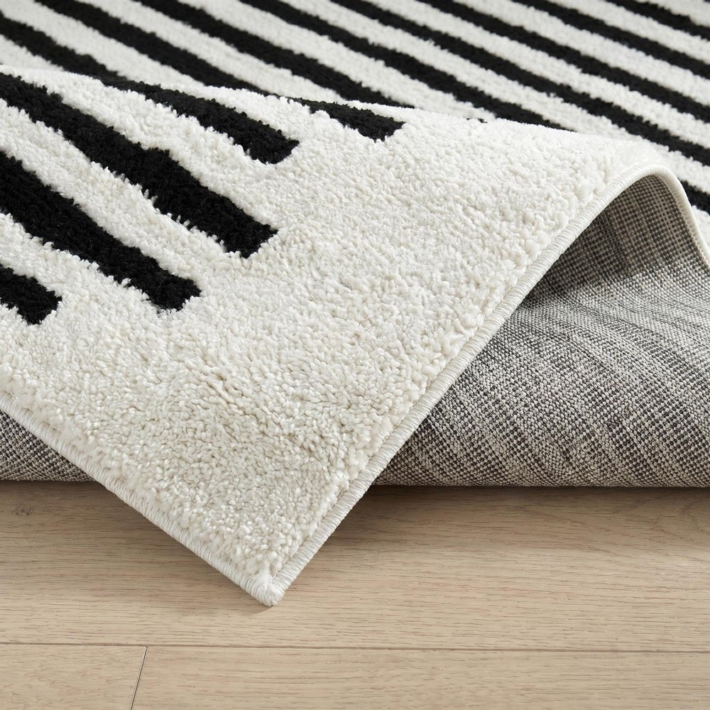 8' X 11' Cream and Black Abstract Distressed Area Rug