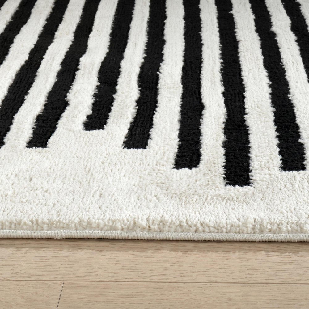 8' X 11' Cream and Black Abstract Distressed Area Rug