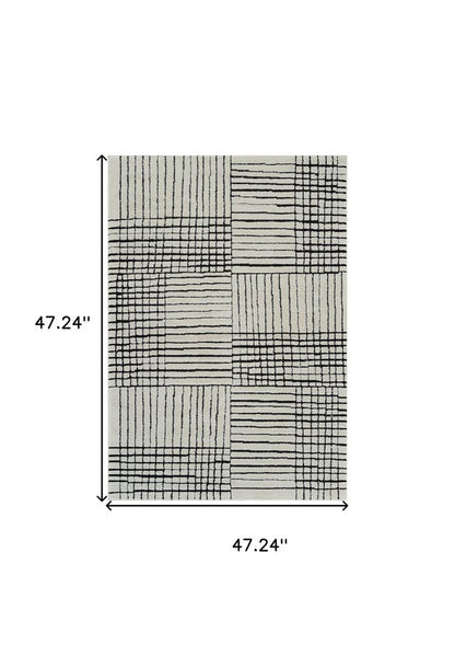 4' X 6' Cream and Black Abstract Distressed Area Rug
