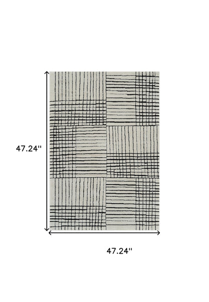 4' X 6' Cream and Black Abstract Distressed Area Rug