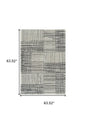 5' X 8' Cream and Black Abstract Distressed Area Rug