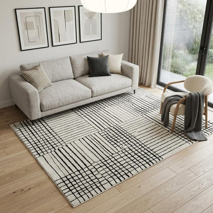 5' X 8' Cream and Black Abstract Distressed Area Rug