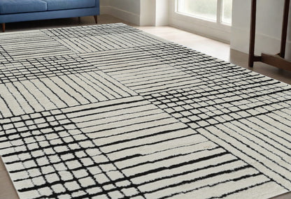 5' X 8' Cream and Black Abstract Distressed Area Rug