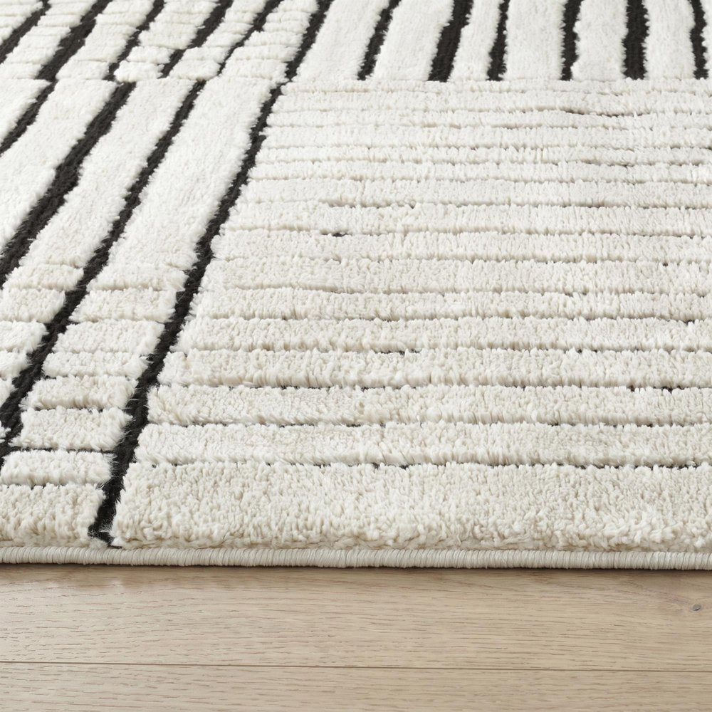 7' X 10' Cream and Black Abstract Distressed Area Rug