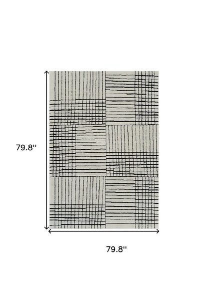 7' X 10' Cream and Black Abstract Distressed Area Rug