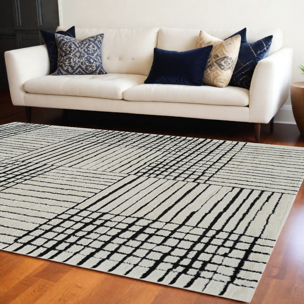 7' X 10' Cream and Black Abstract Distressed Area Rug