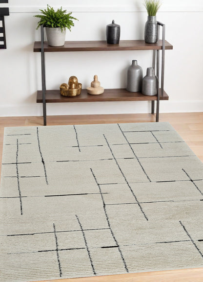 4' X 6' Cream and Green Abstract Distressed Area Rug