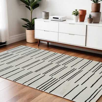 4' X 6' Cream and Black Abstract Distressed Area Rug