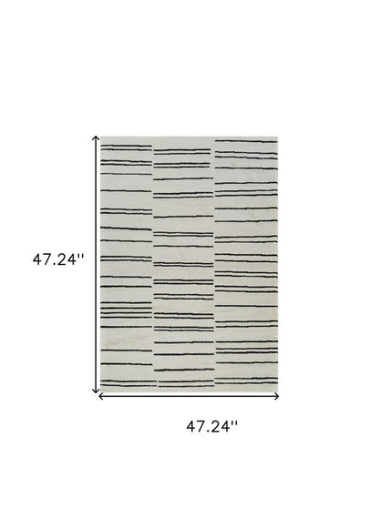 4' X 6' Cream and Black Abstract Distressed Area Rug