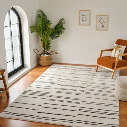 7' X 10' Cream and Black Abstract Distressed Area Rug