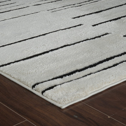 7' X 10' Cream and Black Abstract Distressed Area Rug