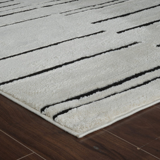 7' X 10' Cream and Black Abstract Distressed Area Rug