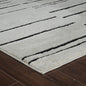 7' X 10' Cream and Black Abstract Distressed Area Rug