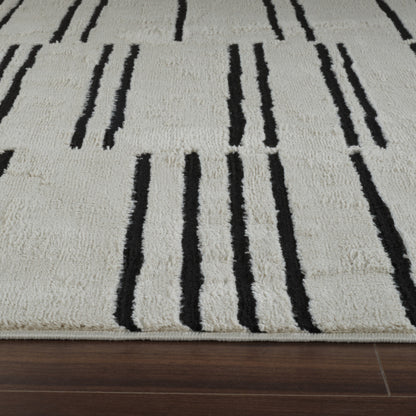 7' X 10' Cream and Black Abstract Distressed Area Rug