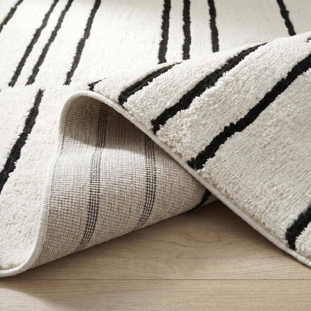 7' X 10' Cream and Black Abstract Distressed Area Rug