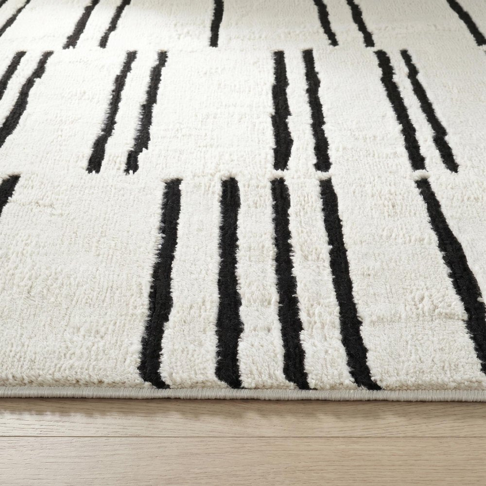 7' X 10' Cream and Black Abstract Distressed Area Rug