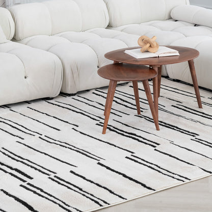 7' X 10' Cream and Black Abstract Distressed Area Rug