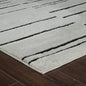 8' X 11' Cream and Black Abstract Distressed Area Rug