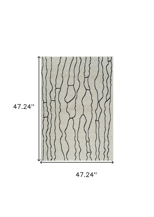 4' X 6' Cream and Black Abstract Distressed Area Rug