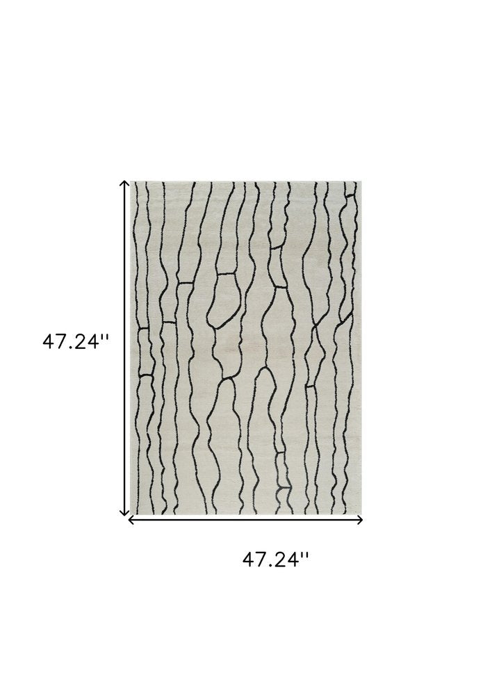 4' X 6' Cream and Black Abstract Distressed Area Rug