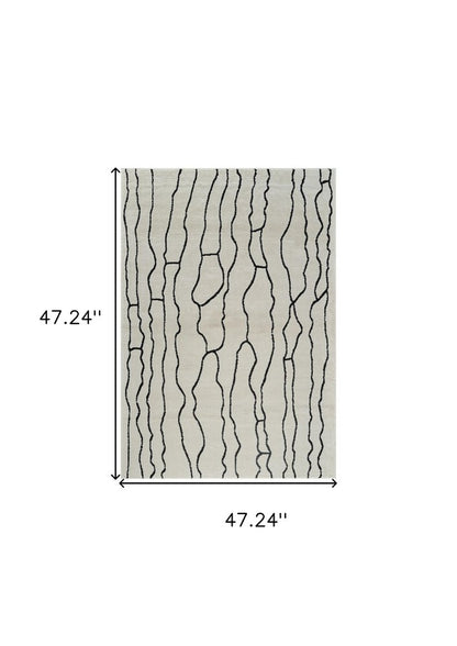 4' X 6' Cream and Black Abstract Distressed Area Rug