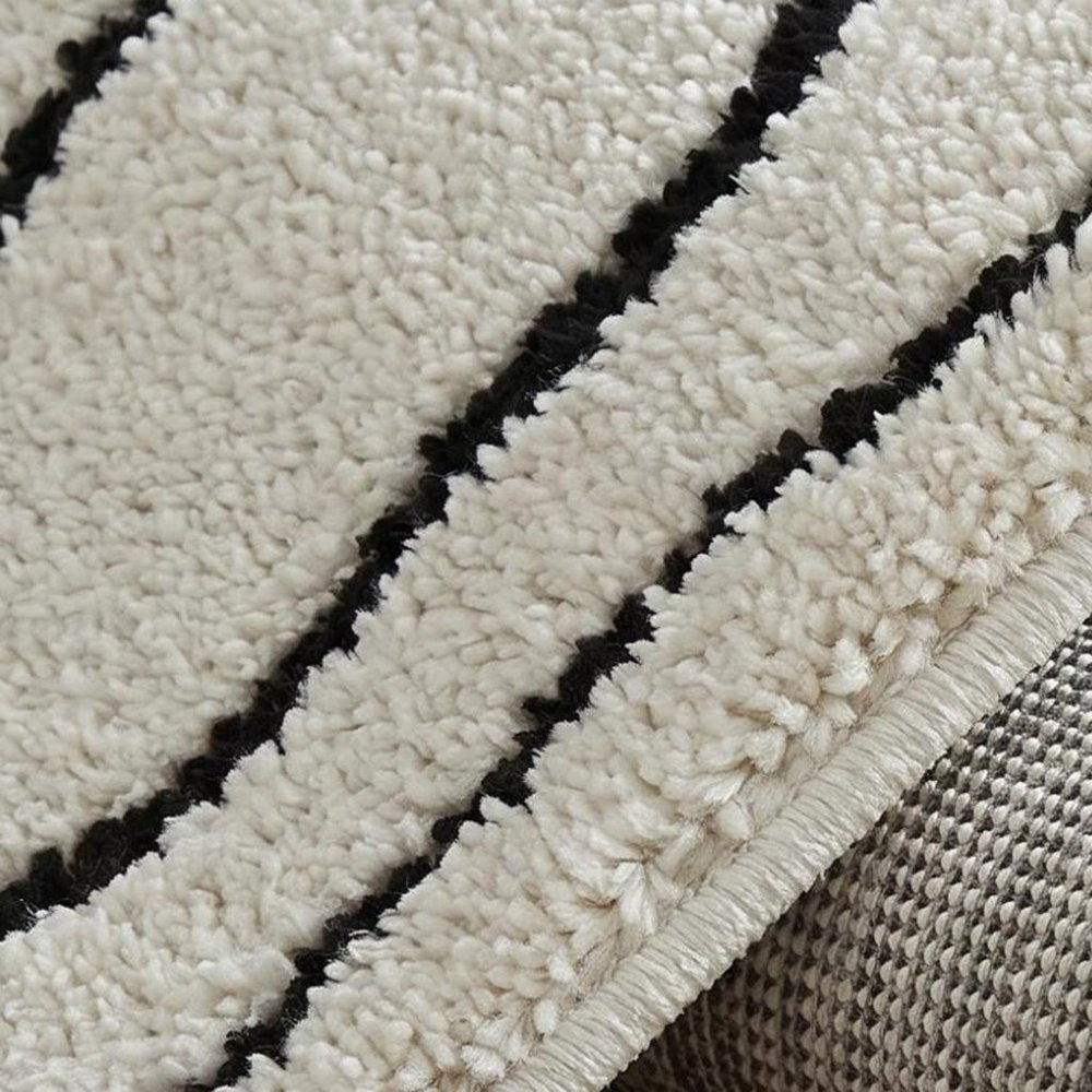 4' X 6' Cream and Black Abstract Distressed Area Rug