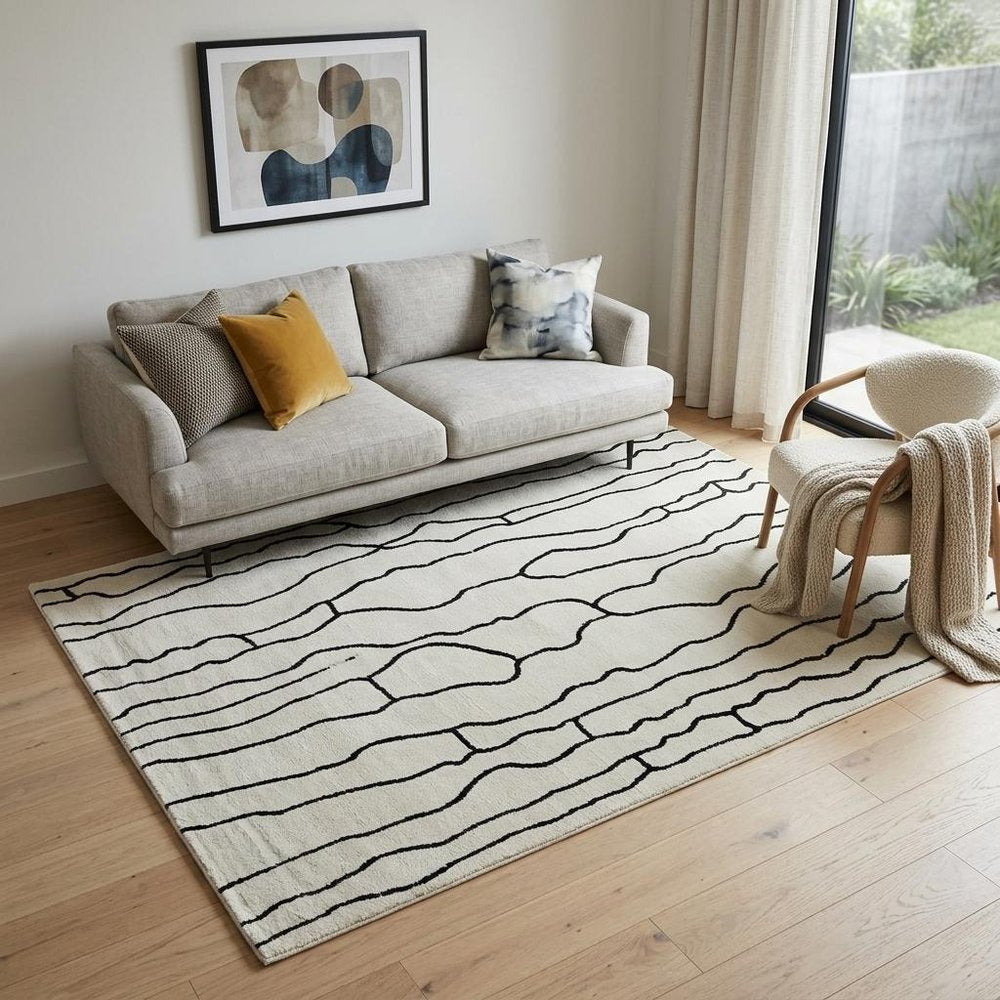5' X 8' Cream and Black Abstract Distressed Area Rug