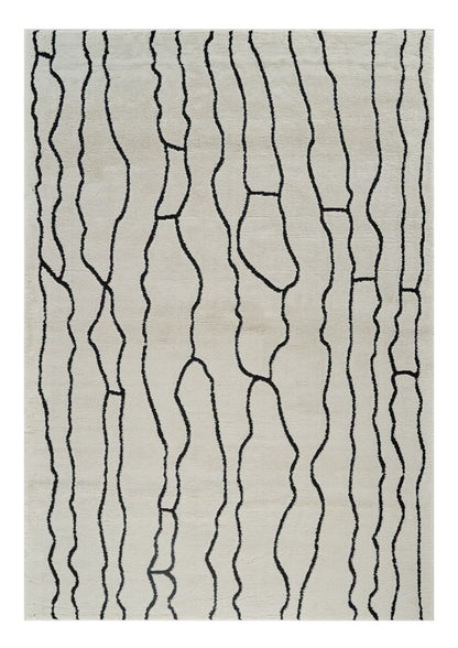 5' X 8' Cream and Black Abstract Distressed Area Rug