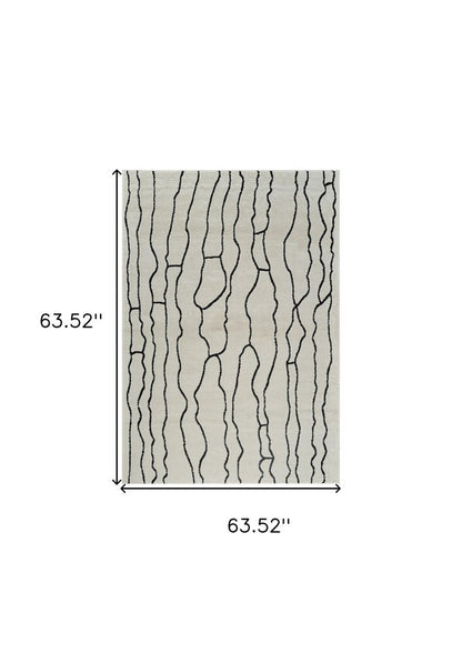 5' X 8' Cream and Black Abstract Distressed Area Rug