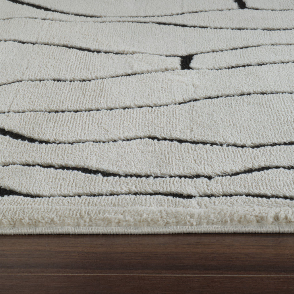 5' X 8' Cream and Black Abstract Distressed Area Rug