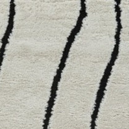 5' X 8' Cream and Black Abstract Distressed Area Rug